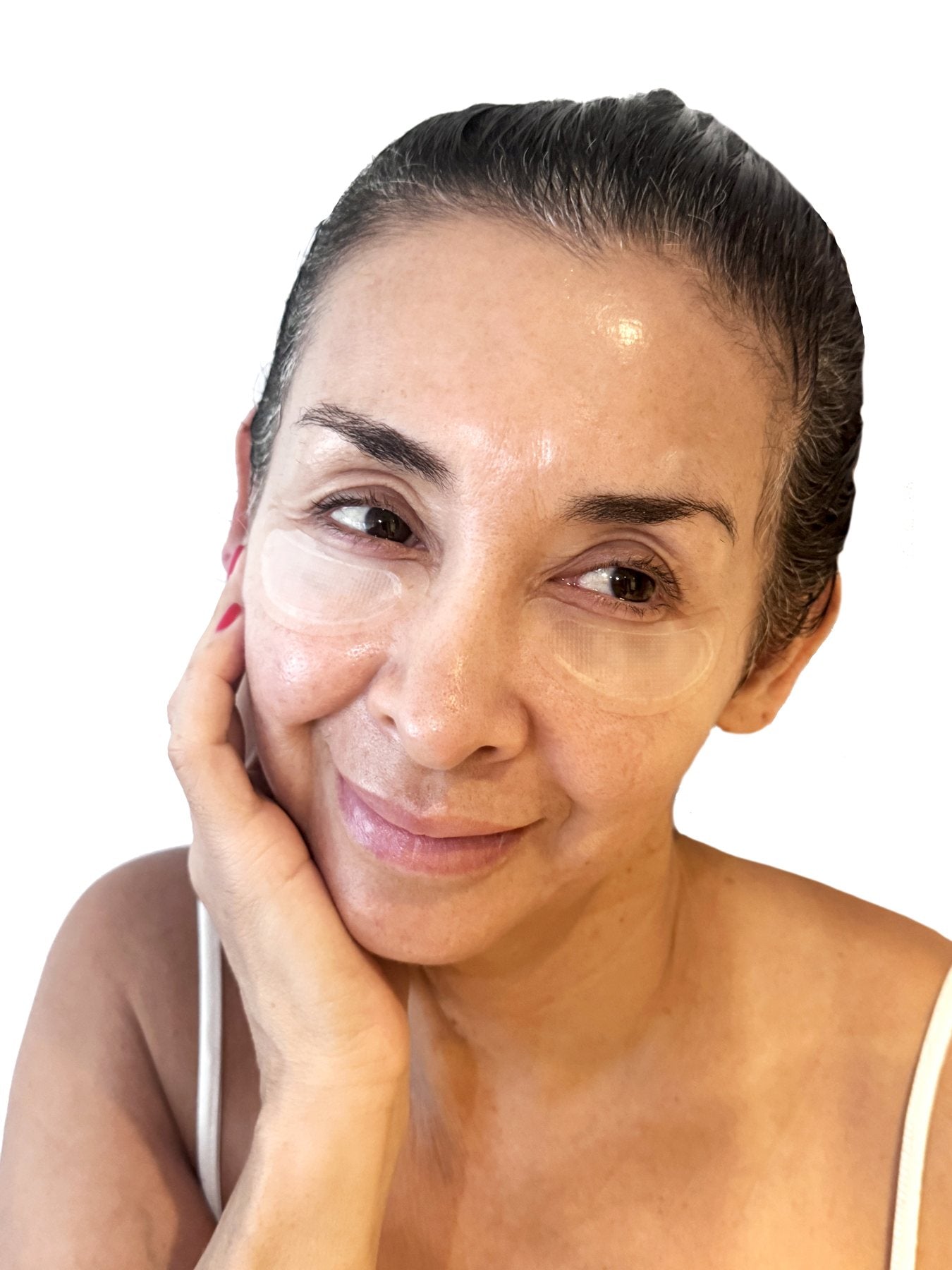 Smiling woman wearing Cotrini Micro‑Dart Eye Patches under both eyes